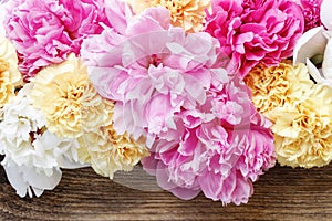 Stunning pink peonies, yellow carnations and roses