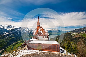Stunning scenery with mountain hut on top Harder Kulm summit - popular tourist attraction over Interlaken, Switzerland photo