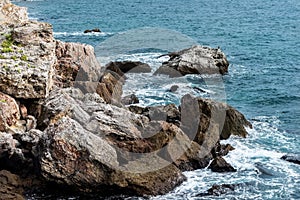 Stunning, scenic view of a rocky shoreline next to the ocean.