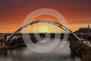 A stunning shot of the autumn landscape along the Cumberland River with bridges over the water, gorgeous autumn trees