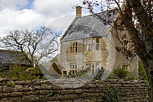 Stunning stone farmhouse with walled garden in a village in England.