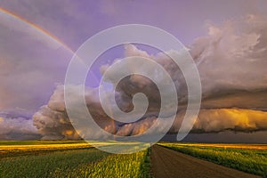 Stunning stormy sunset with rainbow