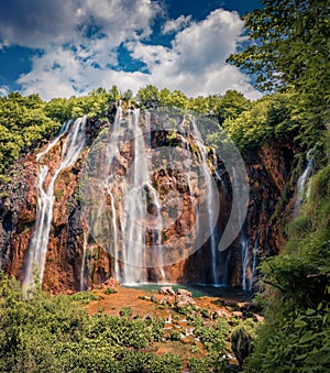 Stunning summer scene of green forest with pure water waterfall in Plitvice National Park.