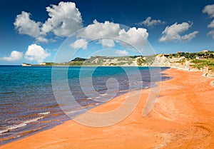 Stunning summer view of famous Xi Beach. Sunny morning scene of Cephalonia island, Greece, Europe. Attractive seascape of Ionian S