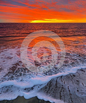 Stunning sunrise over ocean as sun rises in morning