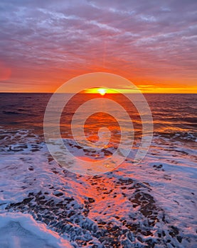 Stunning sunrise over ocean in early morning as sun rises