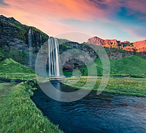 Stunning sunrise on Seljalandfoss Waterfall. Fantastic outdoor scene of Seljalandsa rive.