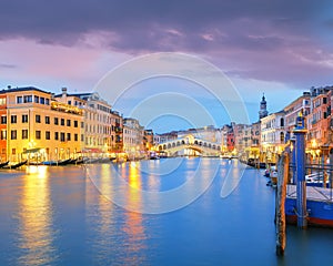 Stunning sunset and evening cityscape of Venice with famous Canal Grande and Rialto Bridge