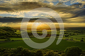 Stunning sunset over countryside landscape