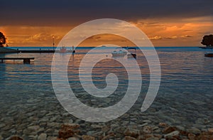 Stunning sunset view from the beach from Green lagoon Aegean sea in Porec,Croatia