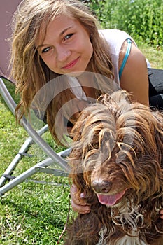 Stunning teenage girl with her pet dog