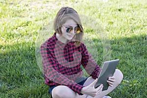 Stunning teenage girl working on clipboard