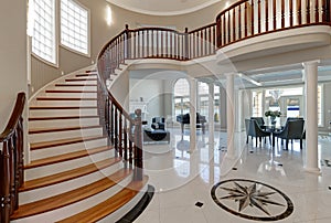 Stunning two story entry foyer with marble mosaic tiled floor