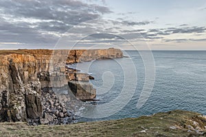 Stunning vibrant landscape image of cliffs around St Govan`s Hea