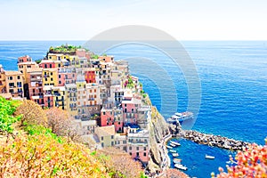 Stunning view of the beautiful and cozy village of Manarola from above in Cinque Terre reserve. Liguria region of Italy.