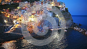 Stunning view of the beautiful and cozy village of Manarola in the Cinque Terre Reserve at sunset. Liguria region of