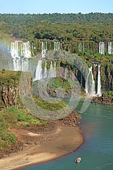 Stunning View of Brazillian side Iguazu Falls with Rainbow and Iguazu River Cruise Boat, Foz do Iguacu, Brazil, South America