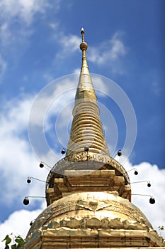 Stunning view of a Buddhist temple spire, dramatically soaring up into the sky photo