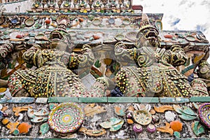 Stunning view of demon guardians supporting Wat Arun Temple, Bangkok, Thailand