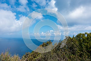 Stunning view down to the sea and the surrounding area from top of the mountain in Ereikoussa island, Greece