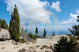 Stunning view down to the sea and the surrounding area from top of the mountain in Ereikoussa island, Greece