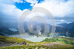 Stunning view on the high mountain after the rain with colorful rainbow over the rocky mountain and glacier in Mt Cook National