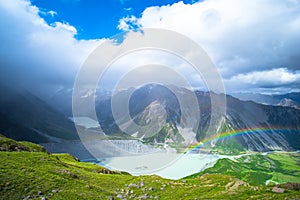 Stunning view on the high mountain after the rain with colorful rainbow over the rocky mountain and glacier in Mt Cook National