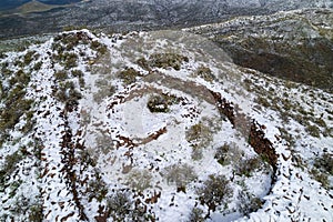 Stunning view of Hohokam ruins blanketed in snow and situated in the Tonto National Forest