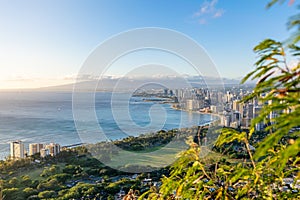 Stunning view of Honolulu and Waikiki Beach seen from the summit of Diamond Head Crater, Oahu, Hawaii. Beautiful evening just befo