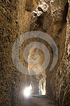 A stunning view inside the cave with rays of light making their way inside. photo