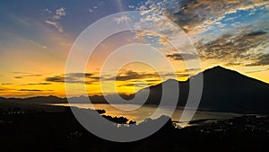 Stunning view on mount Abang and lake Batur at sunrise