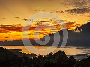 Stunning view on mount Abang and lake Batur at sunrise