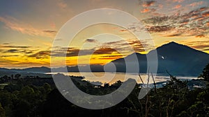 Stunning view on mount Abang and lake Batur at sunrise