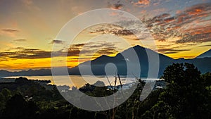 Stunning view on mount Abang and lake Batur at sunrise