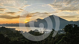 Stunning view on mount Abang and lake Batur at sunrise photo