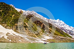 Beautiful view of mountainous lake Saiful Muluk in Naran Valley, Mansehra District, Khyber-Pakhtunkhwa, Northern Areas of Pakistan photo