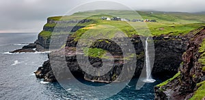 Stunning view of Mulafossur Waterfall. Vagar island, Faroe Islands, Denmark, Europe