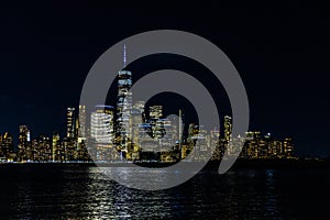 Stunning view of the New York City skyline at night, beautifully illuminated by lights