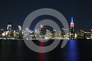 Stunning view of the NYC Skyline and the 9 11 memorial with neon lights at night