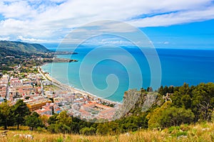 Stunning view over the bay on Tyrrhenian coast by city Cefalu, Sicily, Italy. On the adjacent rocks overlooking blue sea