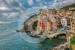 Stunning view of a picturesque coastal town on the edge of a cliff in Riomaggiore, Cinque Terre