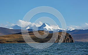 Stunning view of Pumoyongcuo in the Xizang region of China, with mountains in the background