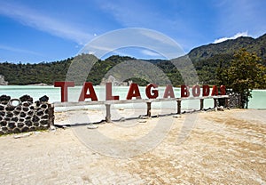 Stunning view of the Talaga Bodas Lake surrounded by a green tropical forest in Garut, West Java, Indonesia photo