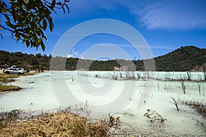 Stunning view of the Talaga Bodas Lake surrounded by a green tropical forest in Garut, West Java, Indonesia photo