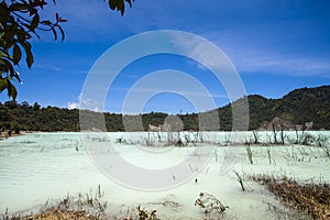 Stunning view of the Talaga Bodas Lake surrounded by a green tropical forest in Garut, West Java, Indonesia photo