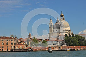 Stunning view of the Venice skyline with the Grand Canal and Basilica Santa Maria Della Salute in the distance during a dramatic
