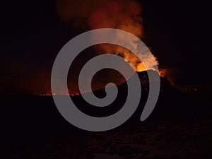 Stunning view of volcanic eruption in Geldingadalir valley near Fagradalsfjall mountain, Reykjanes, Iceland in the dark. photo