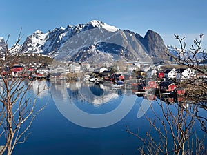 Stunning viewpoint at Reine fishing village, Lofoten Islands, Norway, landscape and seascape of clear water reflection, mountain