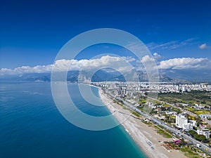 Stunning views of the beach, mountains and Konyaalti Park in Antalya, Turkey.