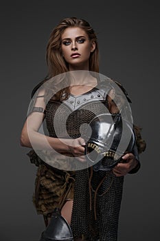 Stunning Viking model dressed in chainmail armor and fur